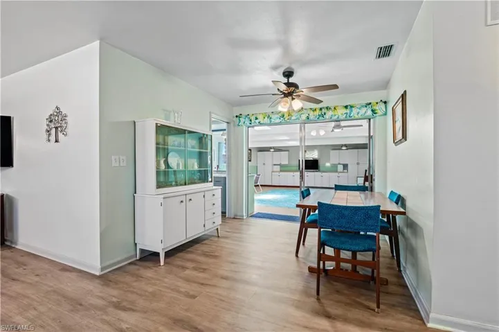 Dining space featuring wood finished floors and a ceiling fan