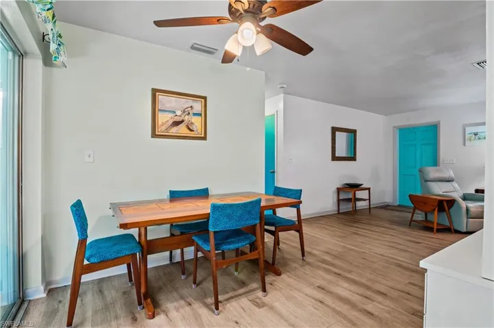 Dining area featuring light wood-style floors and a ceiling fan