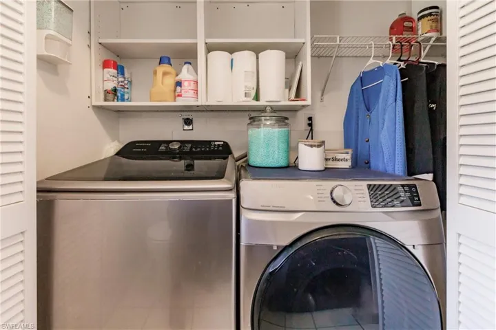 Laundry room with washing machine and dryer
