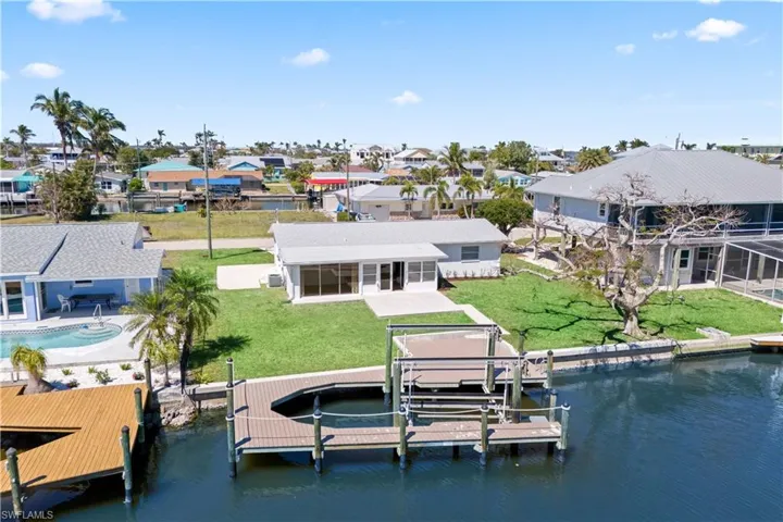 Prepare to be captivated by this majestic Gulf access riverfront home!