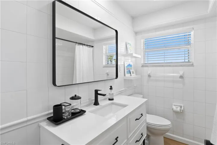 There is plenty of natural light in the bathroom.