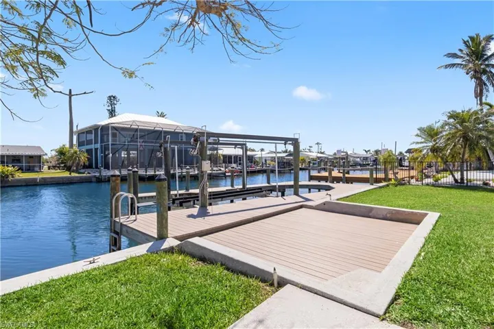 Enjoy sunsets from a nice Adirondack chair on the dock made from composite decking.