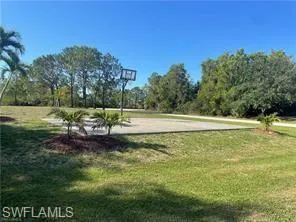 View of community featuring a lawn
