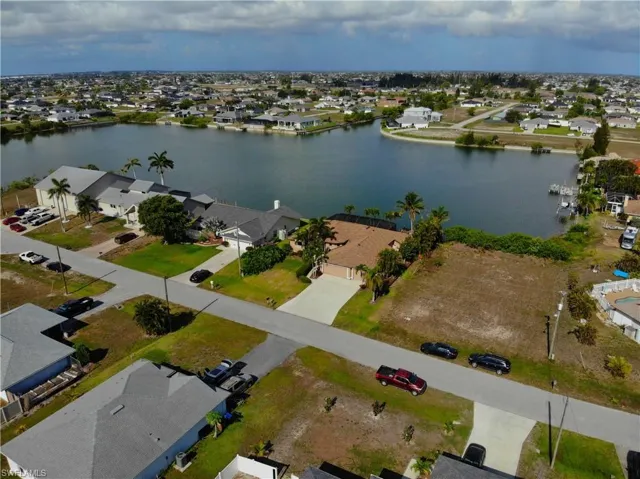 View of property location with a large body of water and nearby suburban area