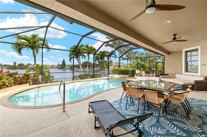 View of pool featuring a water view, a patio area, and an outdoor living space