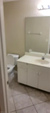 Bathroom featuring vanity and tile patterned floors