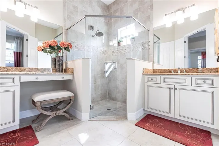 Full bathroom with a stall shower and vanity