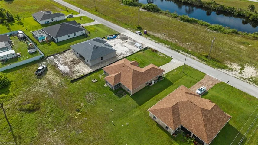 Aerial view of residential area with a nearby body of water