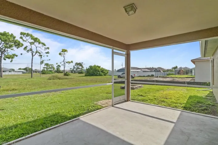 Unfurnished sunroom with a residential view