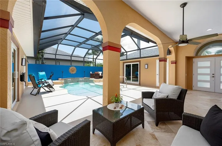 View of swimming pool with ceiling fan