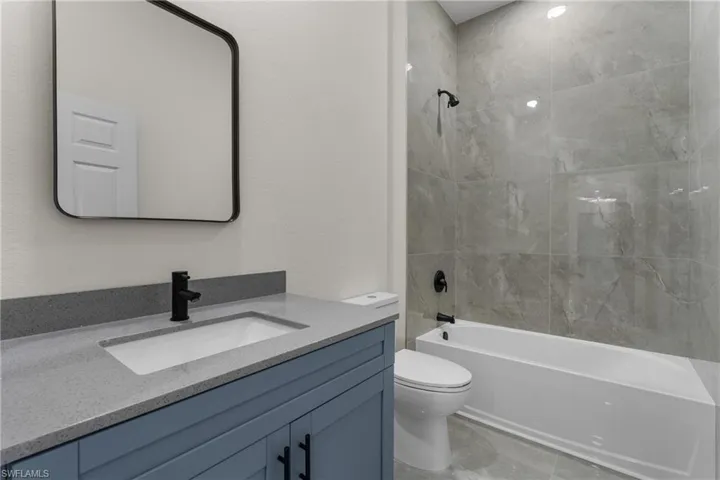 Full bathroom featuring bathing tub / shower combination and vanity