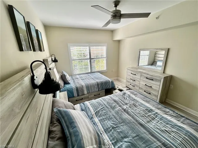 Bedroom featuring ceiling fan and wood finished floors