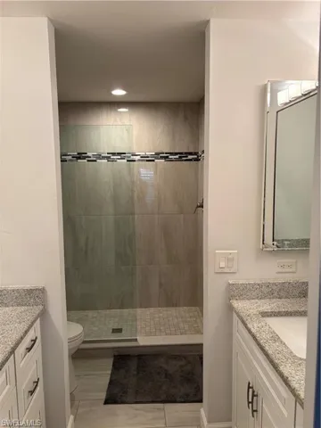 Full bathroom featuring vanity and walk in shower