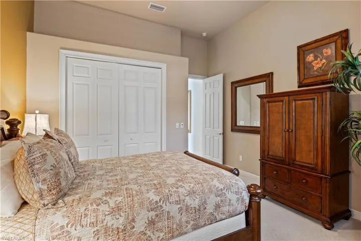 Bedroom with carpet and a closet