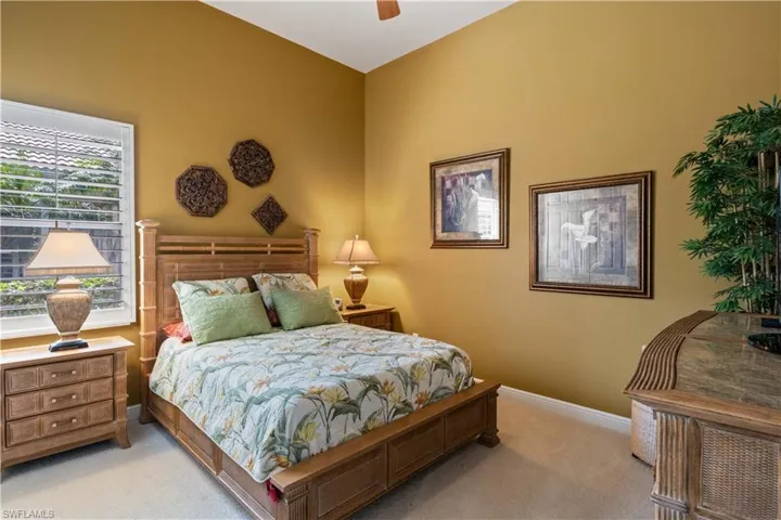 Carpeted bedroom with ceiling fan