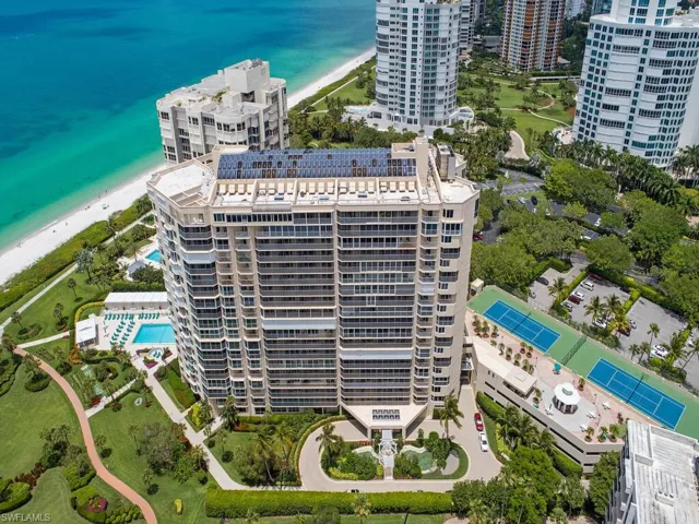 Drone / aerial view featuring a view of the beach and a water view