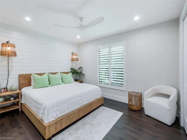 Bedroom featuring ceiling fan, baseboards, wood finished floors, and recessed lighting