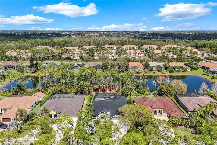 Drone / aerial view with a water view and a residential view