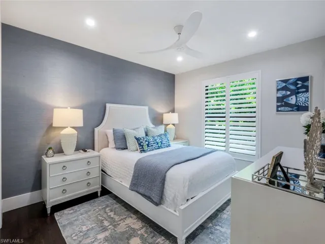 Bedroom with ceiling fan, dark wood-type flooring, recessed lighting, and baseboards