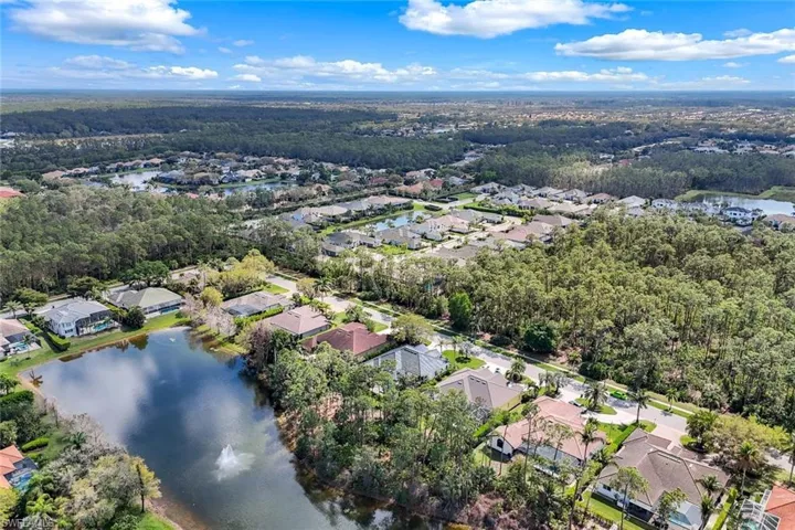 Drone / aerial view featuring a water view and a residential view