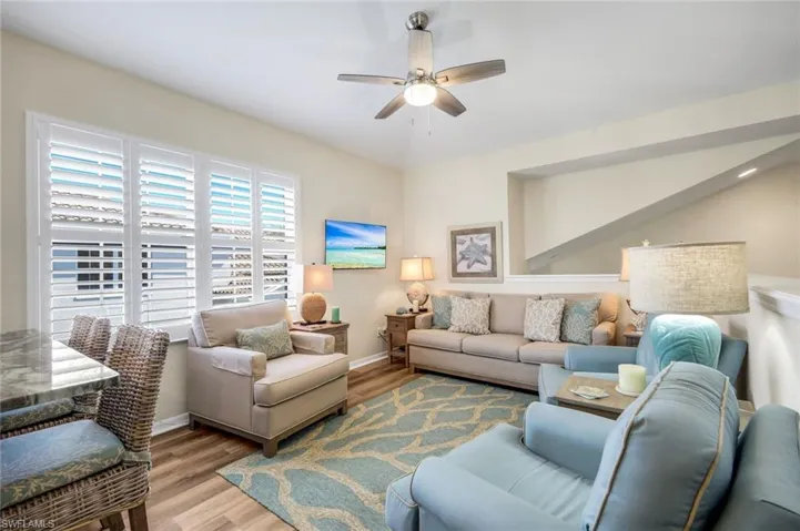 Den - Wood floors and area rug