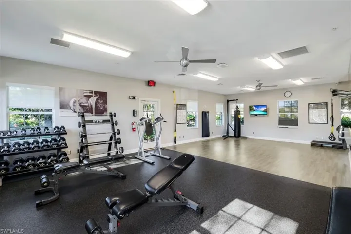 Exercise room featuring a ceiling fan