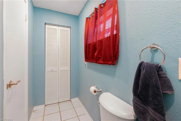 Bathroom with toilet and tile patterned floors