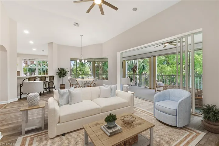 Virtually Staged | Living area with ceiling fan, wood finished floors, a chandelier, and recessed lighting