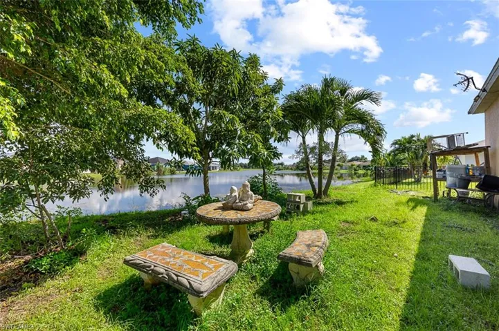 View of yard with a water view