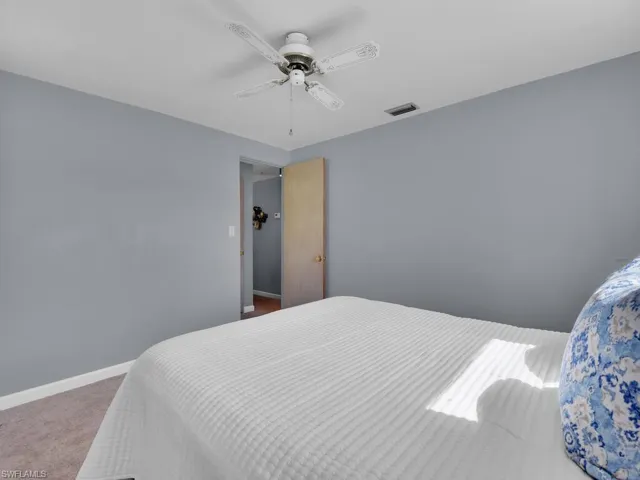 Bedroom featuring carpet flooring and ceiling fan
