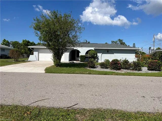 Ranch-style home featuring a garage
