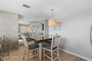 Dining room featuring light wood-style floors and baseboards