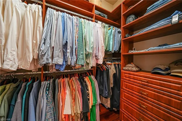 Walk in closet featuring hardwood / wood-style floors