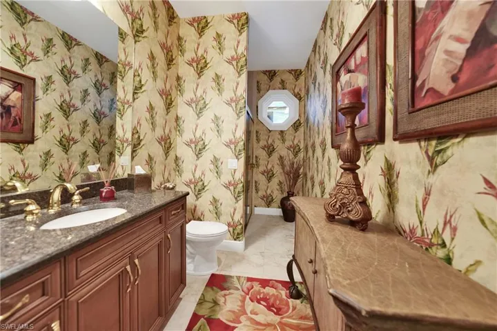 Bathroom featuring vanity and toilet