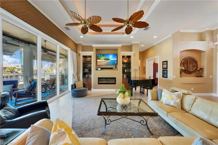 Tiled living room featuring ornamental molding