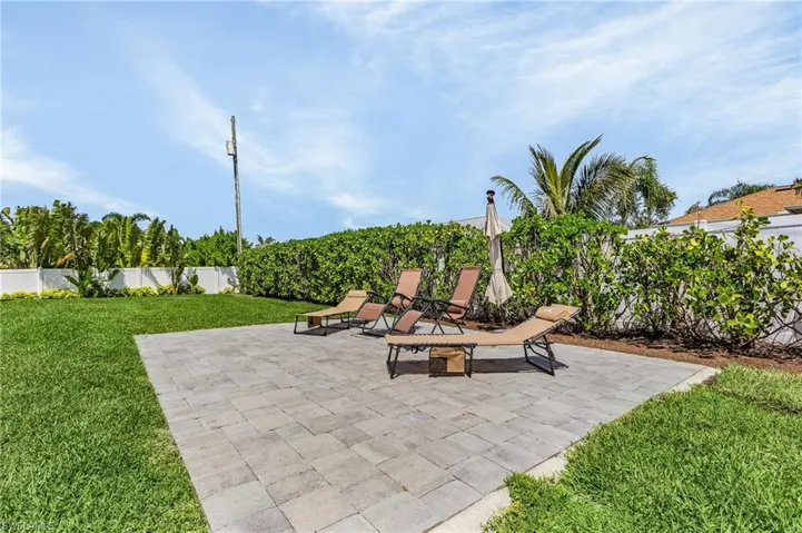 View of patio featuring fence