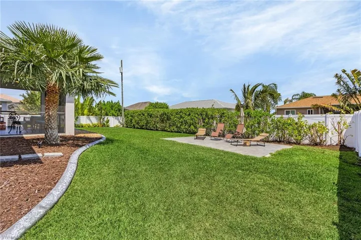 View of yard featuring a fenced backyard and a patio
