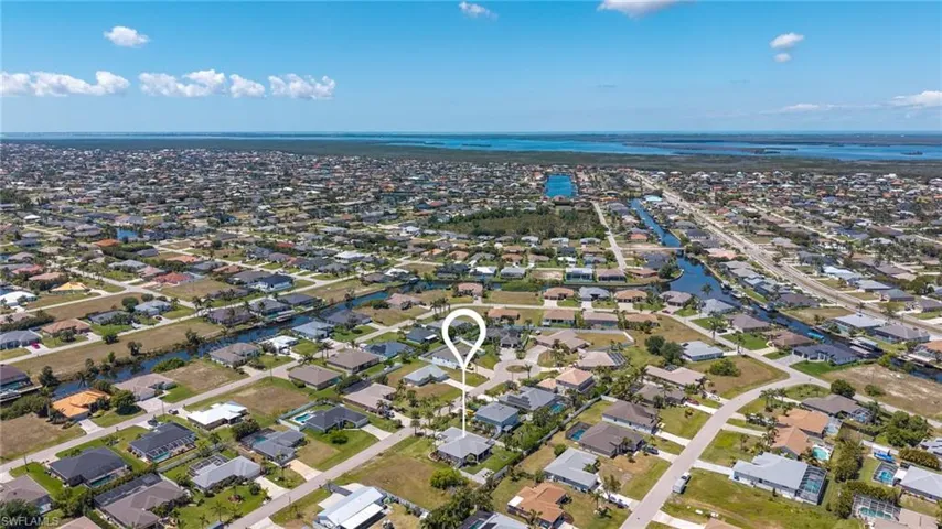 Drone / aerial view featuring a residential view and a water view