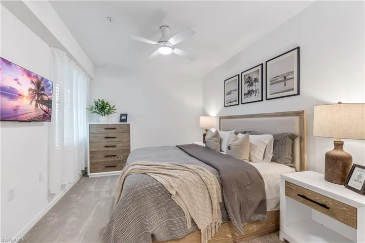 Bedroom with carpet and ceiling fan