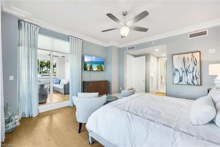 Open the sliding glass doors to access the outdoor space from your primary suite.