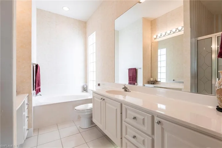 Her side of master bathroom.