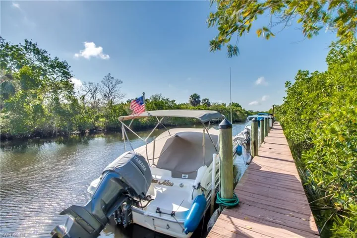 View of dock with a water view
