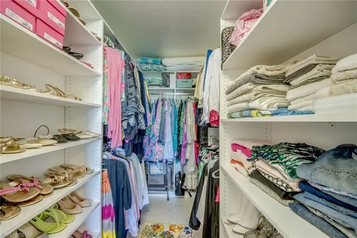 Spacious walk-in closet just redone by closet company