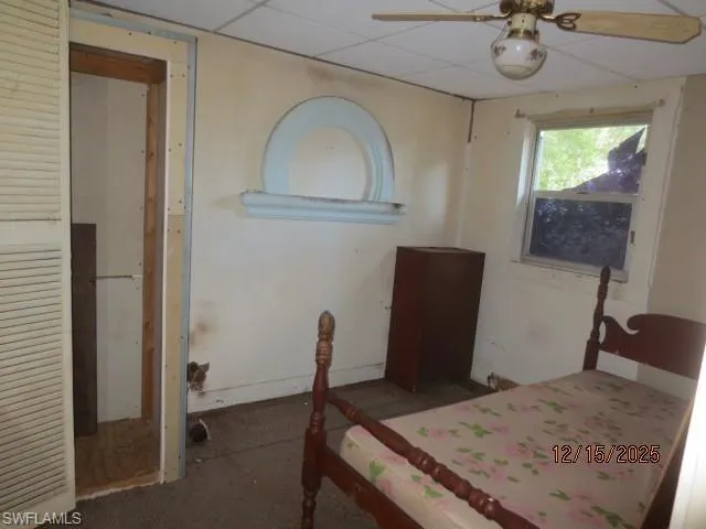 Bedroom 2 featuring ceiling fan and a drop ceiling