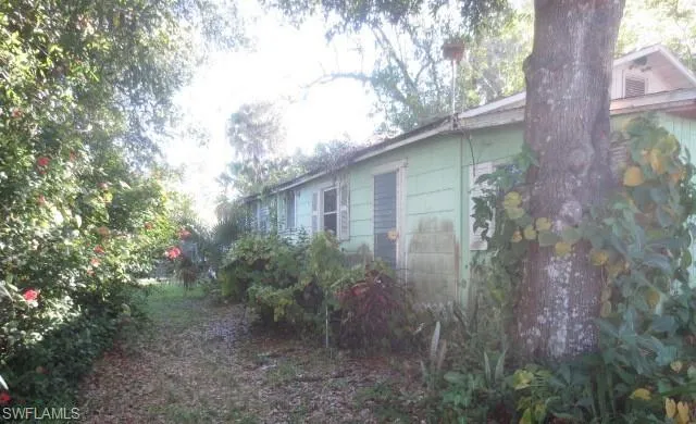 View of property exterior featuring concrete block siding