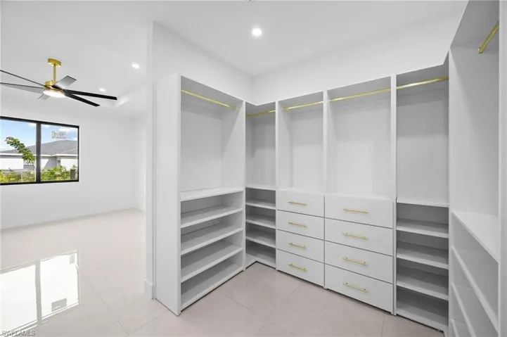 Spacious closet featuring light tile patterned floors
