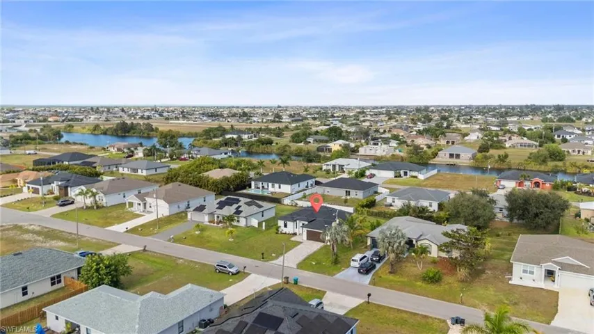 Aerial view of residential area with a nearby body of water