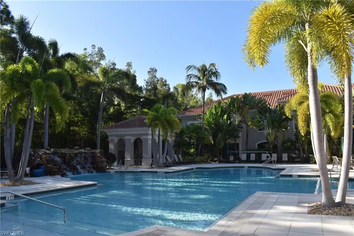 Community pool featuring a patio