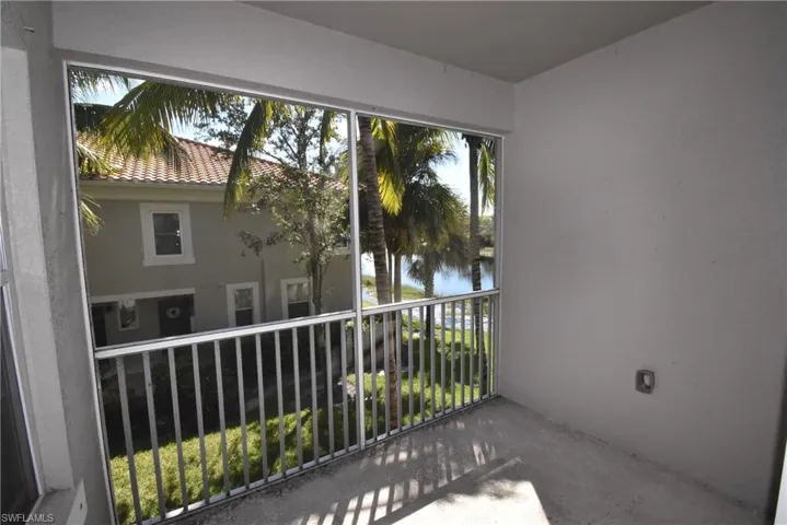 Balcony with a sunroom and a water view