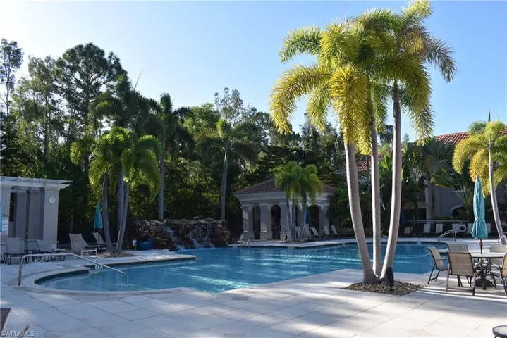 Community pool with a patio